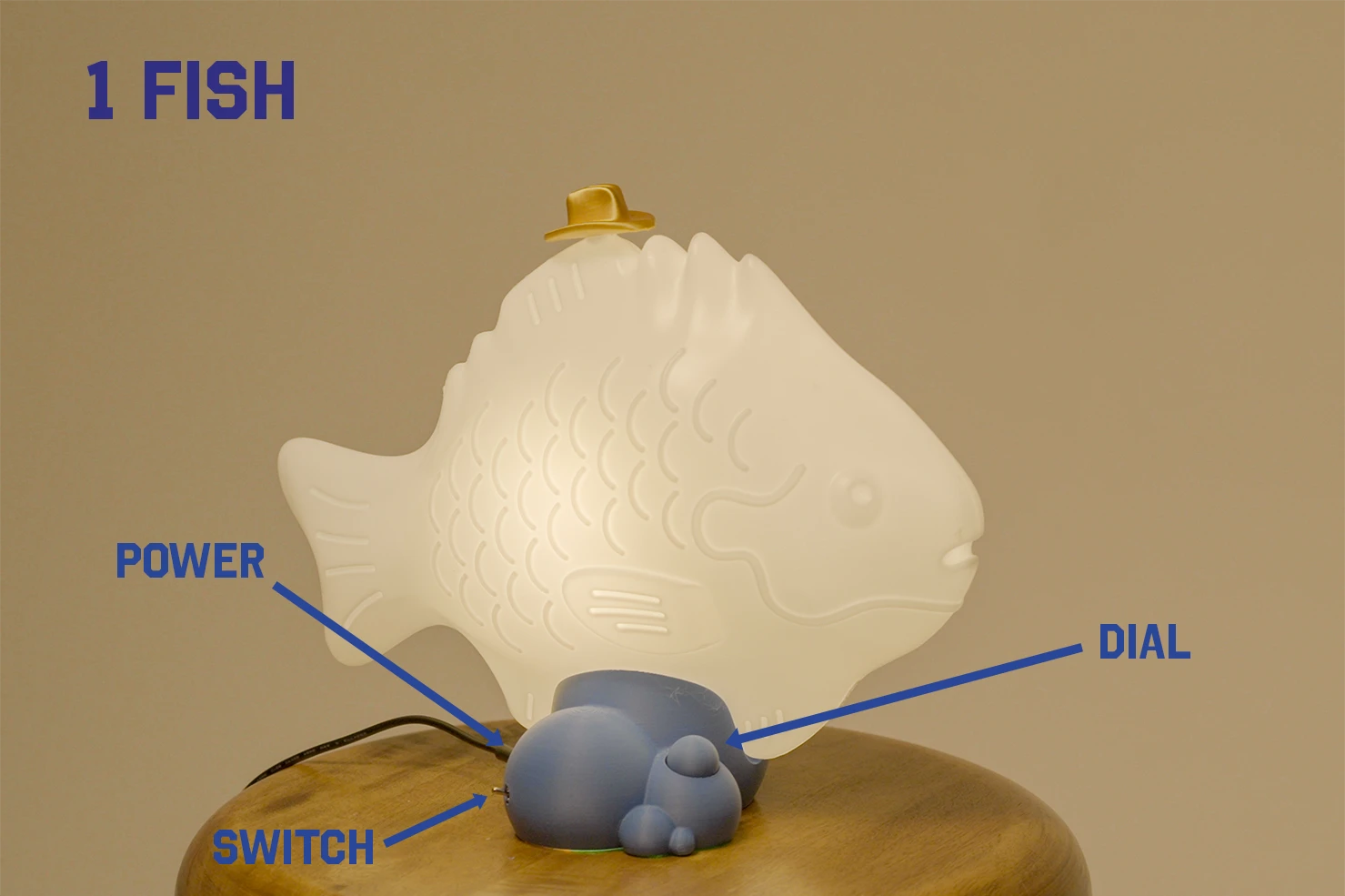 Small Fish Lamp control box with power port, on/off switch, and pushable dial labeled